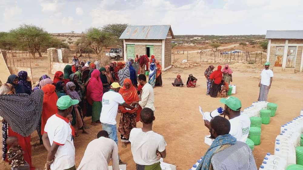 SRS distributing water containers and hygiene supplies to communities